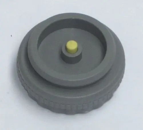 Grauer Ventiladapter mit zentralem gelbem Punkt, geeignet für Daikin Fußbodenheizung, um eine Verbindung in Heizsystemen herzustellen.
